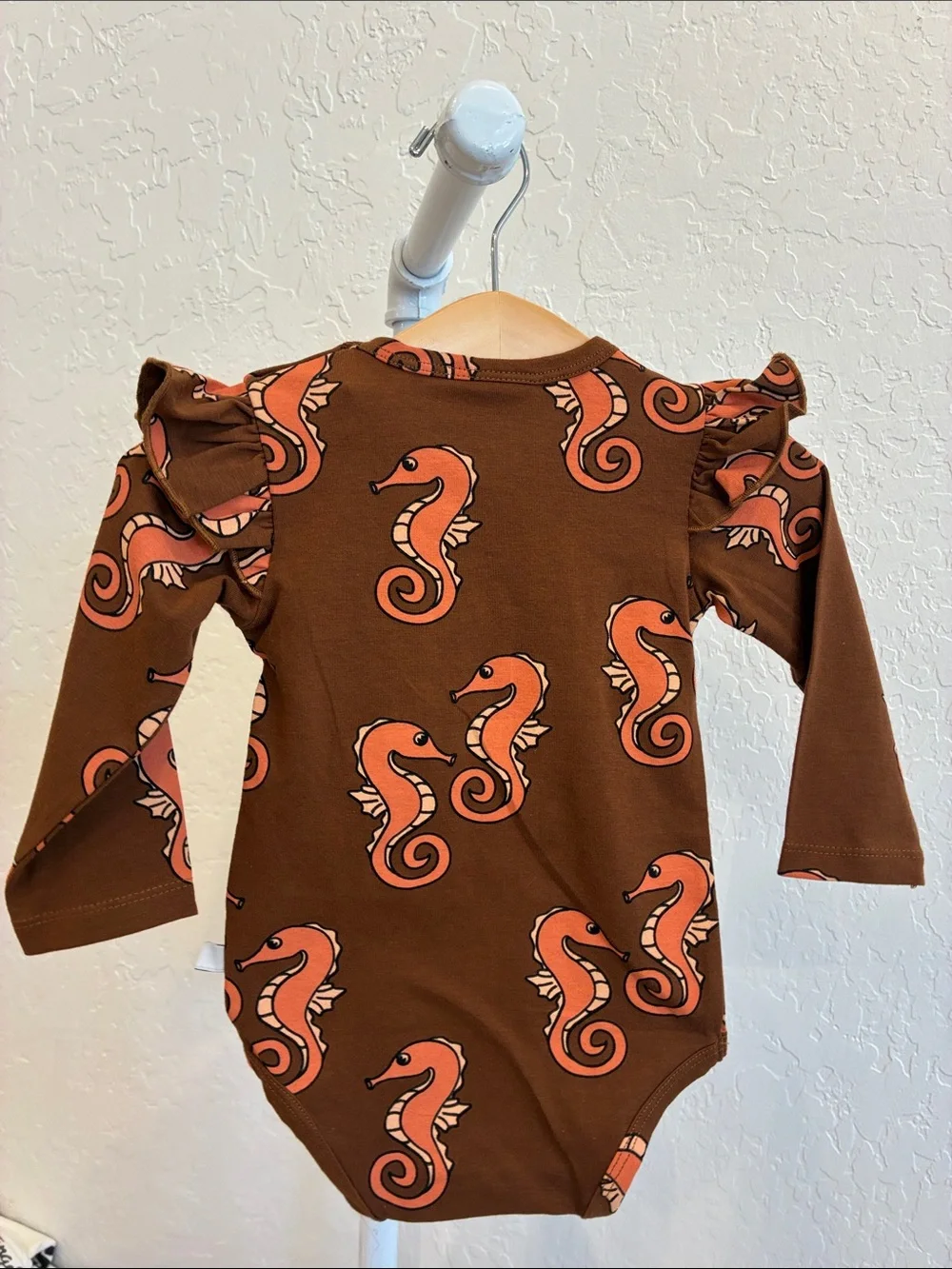 Brown Seahorse Ruffle-Shoulder Baby One-Piece